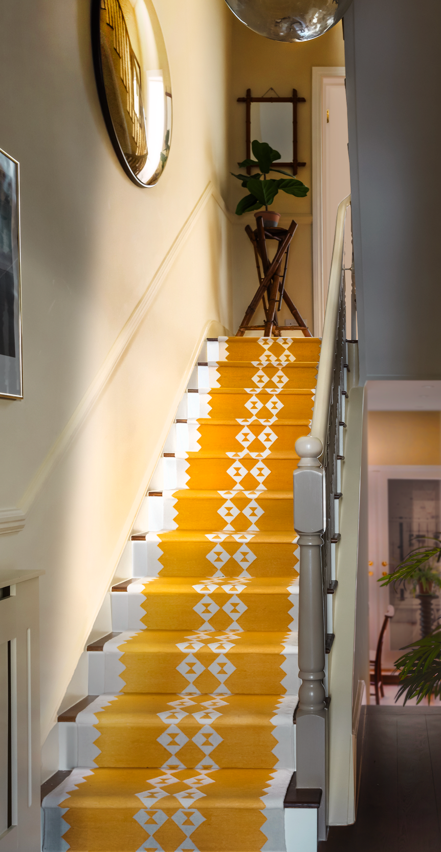 Staircase with a yellow eye duo stair runner by Sophie Cooney Runners