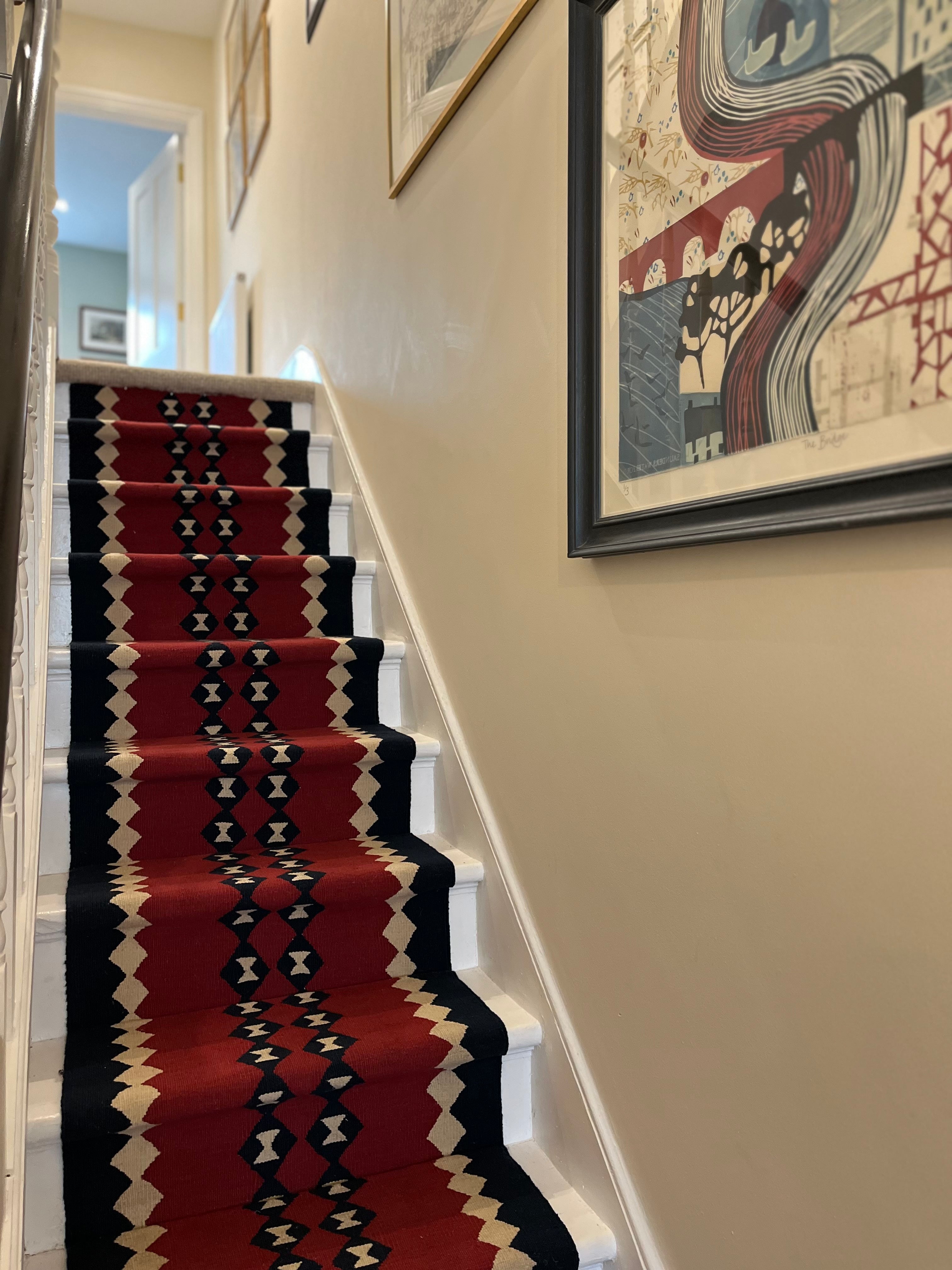 Via duo red wool stair runner by Sophie Cooney Runners in situ on a staircase