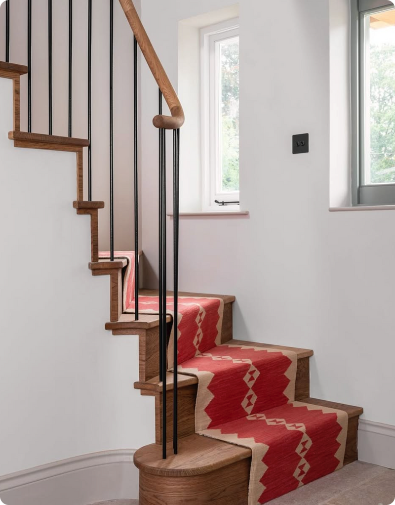 Eye design stair runner on a lovely set of wooden stairs by Sophie Cooney Runners