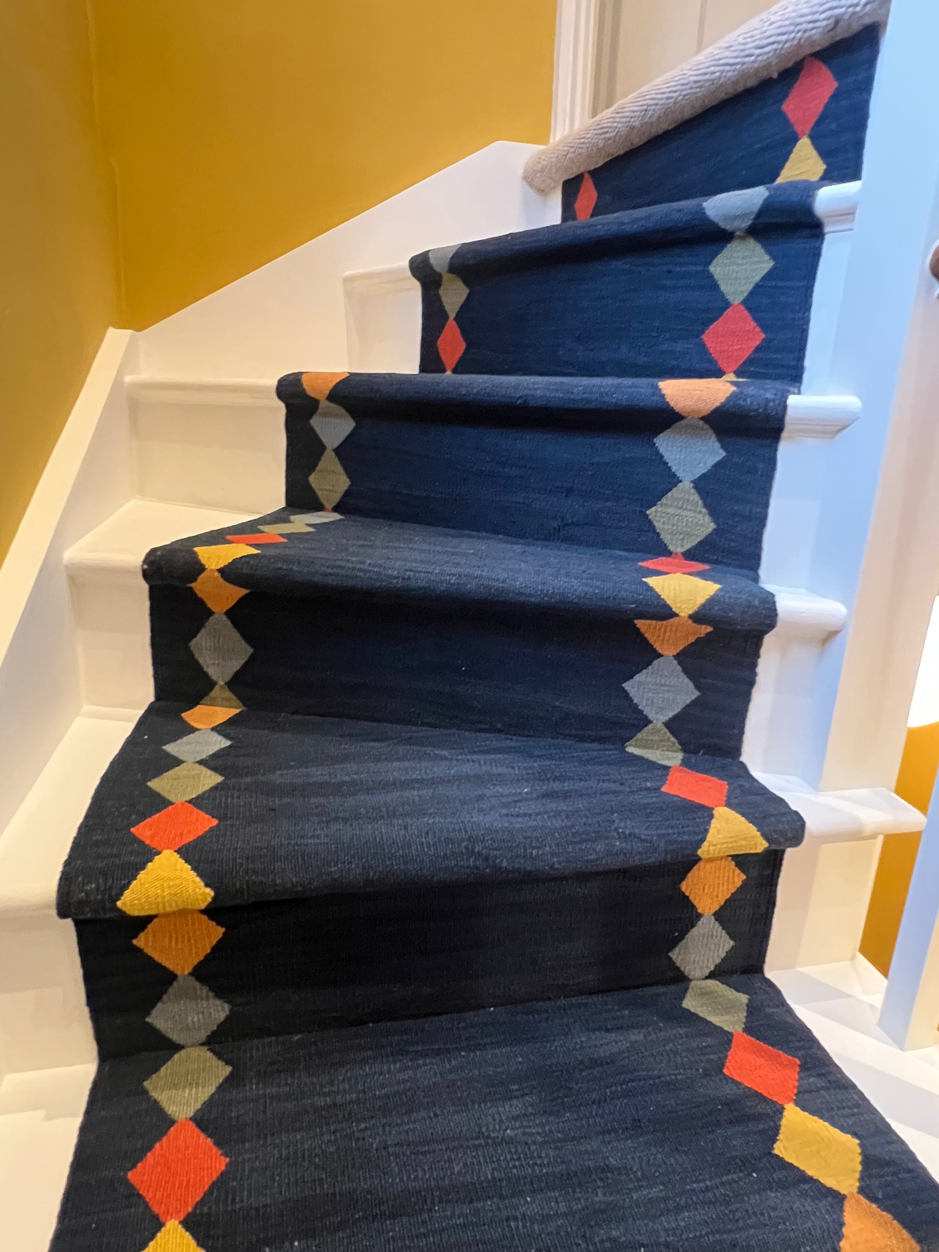 Azra navy wool stair runner by Sophie Cooney Runners on a winding staircase