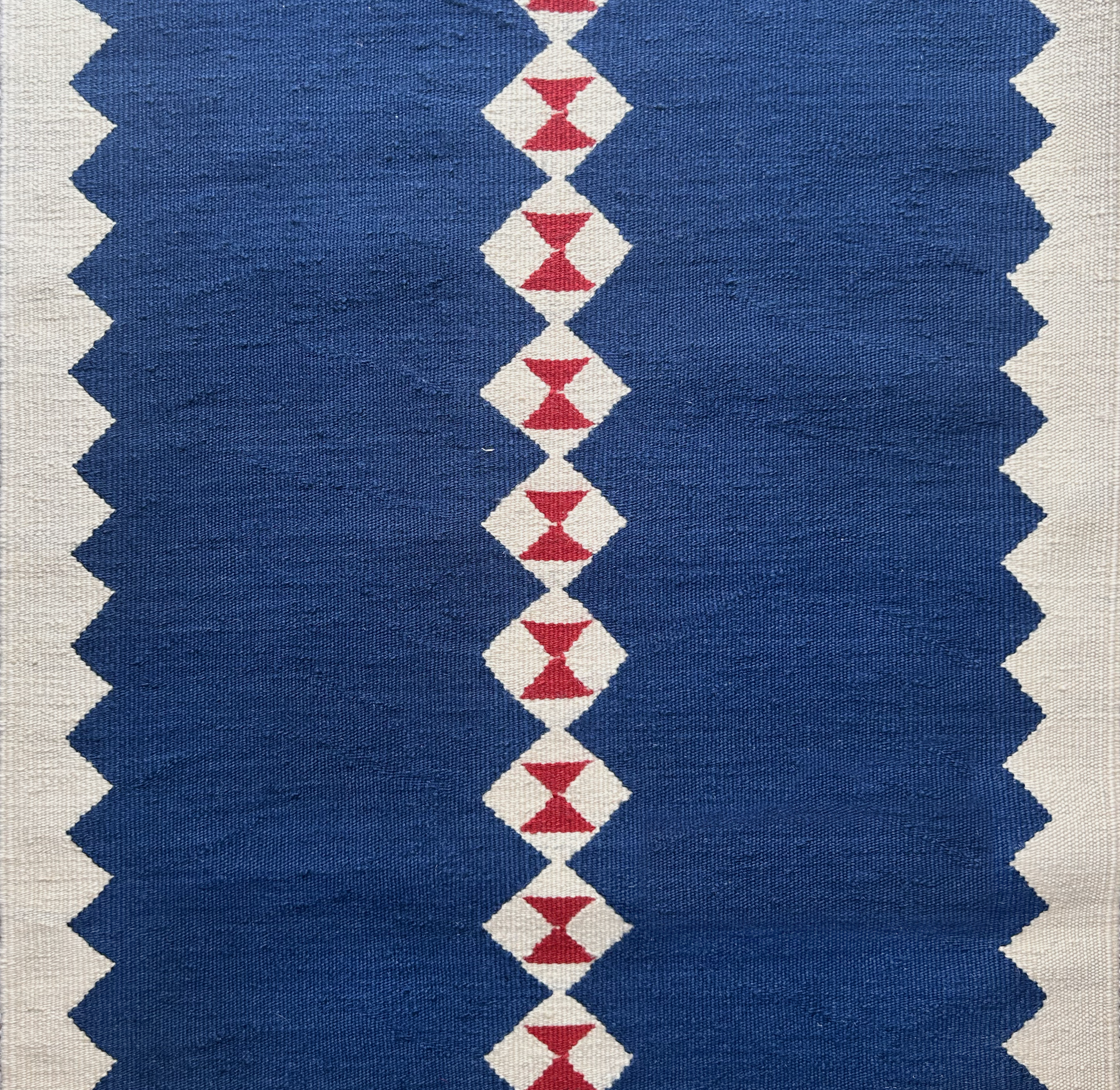 Eye Navy Wool Stair Runner with blue, white, and red geometric pattern