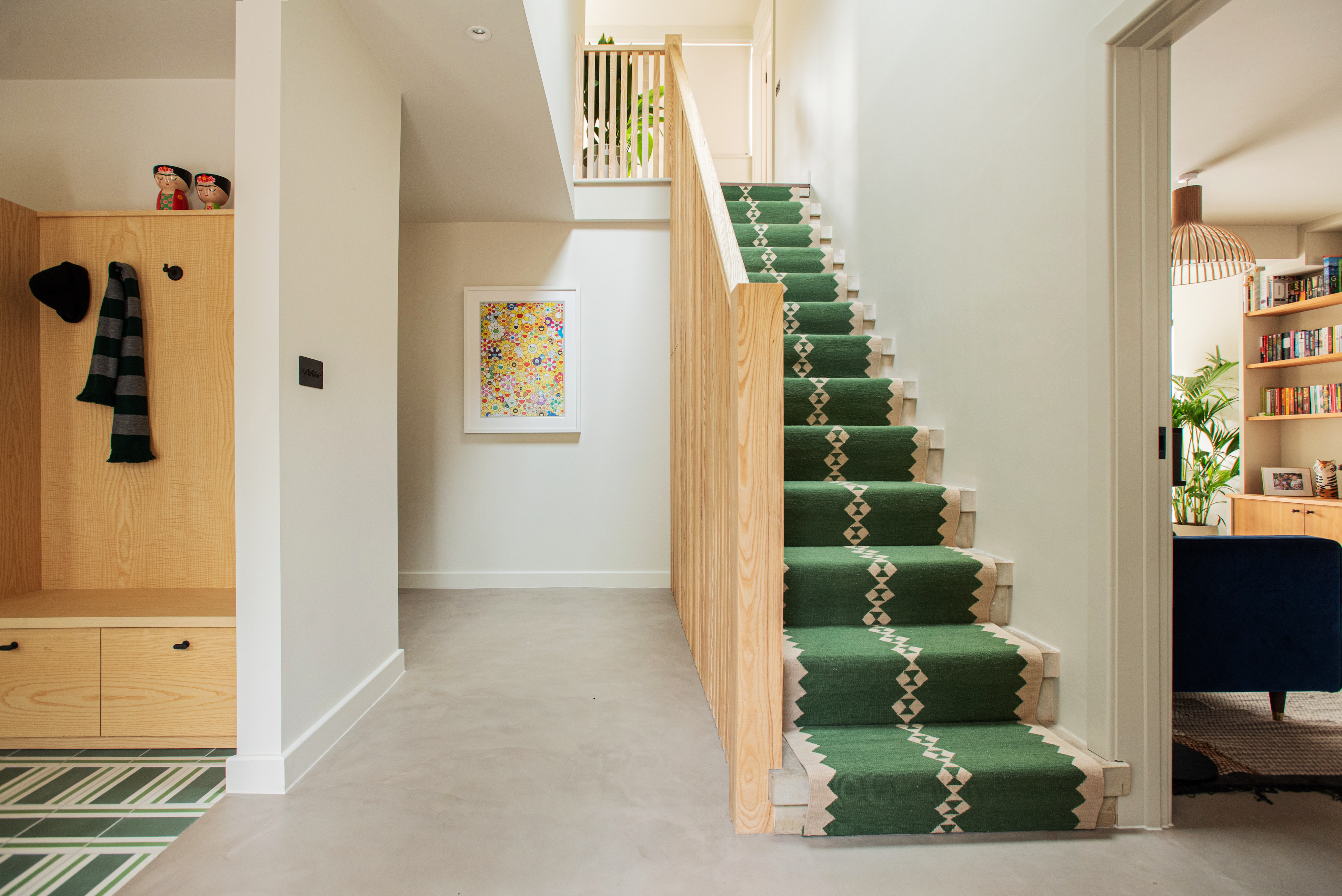 Green eye wool stair runner by Sophie Cooney Runners in situ in wonderful bright entrance with white walls